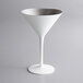A white martini glass with a silver rim.