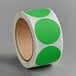 A roll of Lavex fluorescent green round inventory labels with white polka dots.