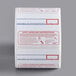 A roll of white Cardinal Detecto safe handling labels with text and images.