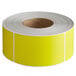 A roll of yellow labels with a white background.
