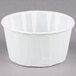 A white Solo paper souffle cup.