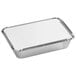 A rectangular aluminum foil container with a white board lid.