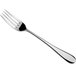 An Arcoroc stainless steel table fork with a silver handle.