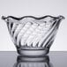 An Anchor Hocking clear glass sherbet bowl with a wavy design.