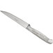 A Chef & Sommelier stainless steel steak knife with a white handle.