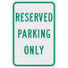 A green and white sign that says "Reserved Parking Only" with white text on a green background.