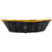 An oval black and gold rattan basket with a handle.