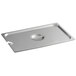 A Carlisle stainless steel steam table pan cover with a slot over a stainless steel pan.