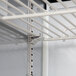 A metal shelf with white rods for a Beverage-Air Elite Series Refrigerated Sandwich Prep Table.