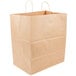 A close-up of a brown Duro paper bag with handles.