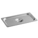 A Carlisle stainless steel steam table pan cover on a stainless steel tray.