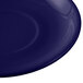 A cobalt blue Tuxton china saucer with a white circle.