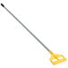 A yellow and grey Rubbermaid mop handle with side gate style.