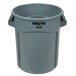 A gray Rubbermaid Brute trash can with black text.