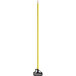 A yellow and black Carlisle Sparta mop handle.