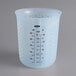 An OXO translucent silicone measuring cup with black text on the measuring scale.