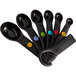 A close-up of a black OXO measuring spoon set.