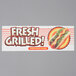 An APW Wyott hot dog bun cabinet on a counter with a white rectangular sign with the words "fresh grilled" on it.