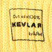 A close up of a yellow knitted fabric similar to a sweater.