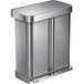 A simplehuman brushed stainless steel rectangular dual compartment trash and recycling can with a lid.