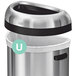 A simplehuman white custom fit trash can liner in a silver trash can with a black lid.