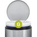 A close up of a simplehuman Code G white trash can liner with a green and white "g" logo.