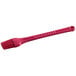 A Fox Run silicone bristle pastry and basting brush with a pink plastic handle.