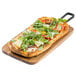 A pizza on a Tablecraft rectangular acacia wood serving board.