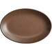 A brown oval Acopa coupe platter with a black border.