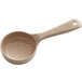 A brown plastic Carlisle short handle portion spoon for measuring.