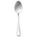 An Oneida New Rim stainless steel tablespoon with a silver handle and bowl.