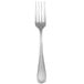 A stainless steel Oneida European table fork with a white background.