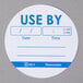 A roll of 500 round white paper labels with blue "Use By" text.