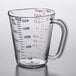 A Carlisle clear polycarbonate measuring cup with a measuring scale and red numbers.