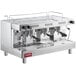 A silver Estella Caffe three group automatic espresso machine with black handles.