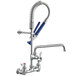 A Waterloo low profile pre-rinse faucet with blue and white accents and a hose.