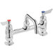 A Waterloo deck-mounted faucet with two red handles and a 6" swing spout.