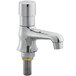 A close up of a chrome Waterloo Deck-Mounted Metering Faucet with a single handle and bolt.