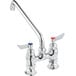 A silver Waterloo deck-mount faucet with chrome handles and a swing spout.