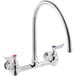 A silver Waterloo wall mount faucet with red and blue knobs.
