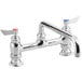 A Waterloo deck-mounted faucet with two handles and a 12" swing spout in chrome.