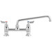A chrome Waterloo deck-mount faucet with two silver handles and a 12" swing spout.