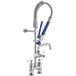 A Waterloo deck-mounted pre-rinse faucet with blue handles and a hose.