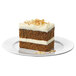 A slice of carrot cake with white frosting on a plate.