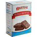 A case of Krusteaz Professional Fudge Brownie Mix on a kitchen counter.