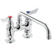 A Waterloo deck-mounted faucet with silver and red knobs.