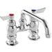 A silver Waterloo deck-mounted faucet with red and blue buttons.