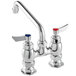 A silver Waterloo deck-mounted faucet with red and blue knobs.