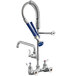 A Waterloo low profile wall-mounted pre-rinse faucet with a hose.