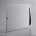 A white rectangular glass lid with a handle.